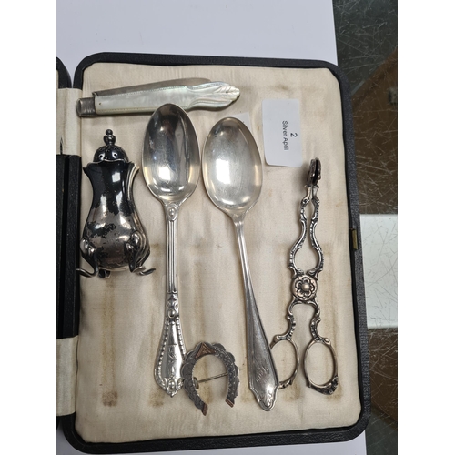 2 - A cased set of silver handled knives by Harrison Fisher and Co. Also with a brooch, on silver and Mo... 