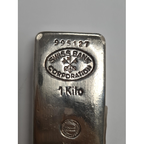30 - A 999 silver kilo bar, with engraved 'Swiss Bank Corporation'. Condition Report: minor denting and n... 
