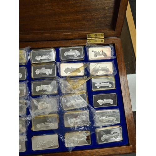 33 - The Lord Montagu Collection of Great Cars Ingots. A cased set of 36 silver ingots by John Pinches Lt... 