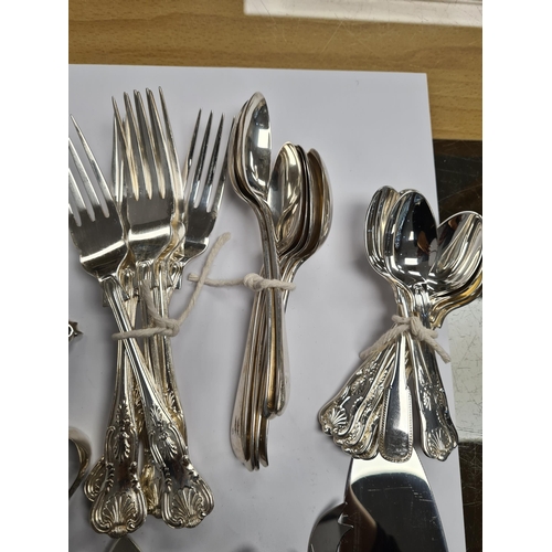 37 - A silver toast rack by Walker and Hall, Sheffield 1923. Also a pretty pair of Victorian small knife ... 