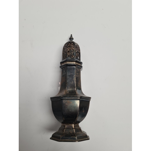 38 - A silver caster, Birmingham 1919, on a raised pedestal, octagonal base. 17.5cm tall approx. Conditio... 