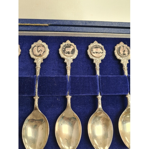 40 - John Pinches, the Twelve Zodiac spoons, a set of twelve silver spoons, cased, with Certificate of Au... 