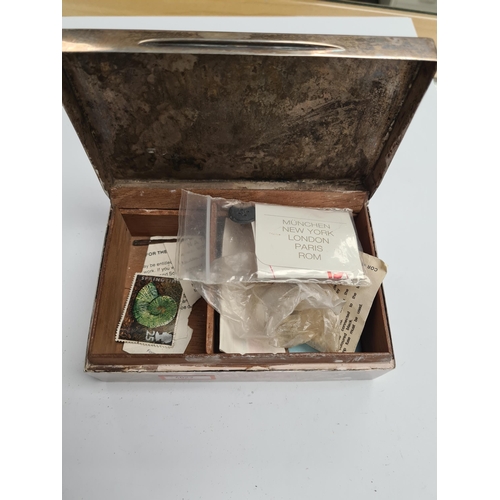 41 - A silver cigarette box by Goldsmiths and Silver Smiths Co Ltd., London 1913. Condition Report: Lid d... 