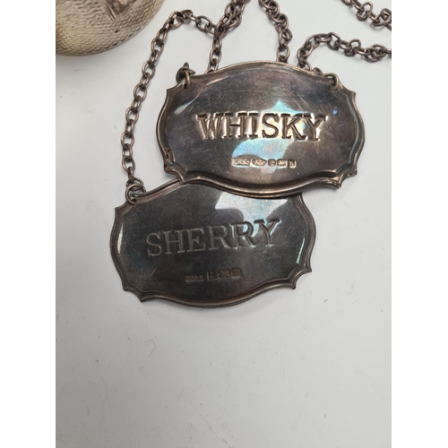 46 - Silver decanter labels for 'Whisky' and 'Sherry'. Also with a pair of silver engine turned napkin ri... 