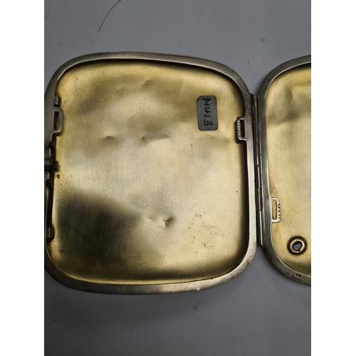 47 - A very pretty silver cigarette case, probably Danish, having hammered design, a blue stone detail, a... 