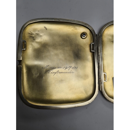 47 - A very pretty silver cigarette case, probably Danish, having hammered design, a blue stone detail, a... 