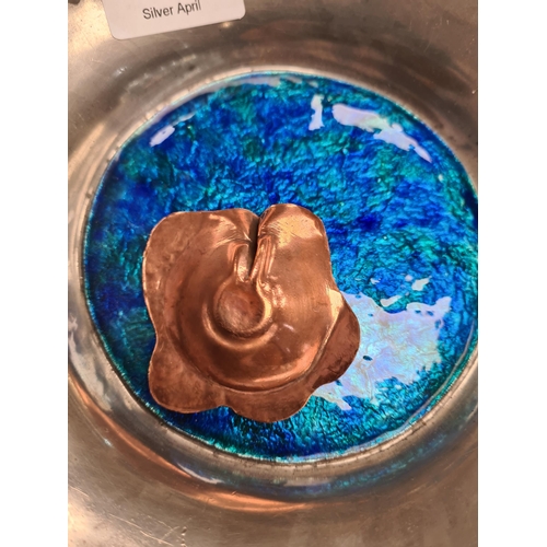 49 - Liberty and Co. A Tudric pewter bowl by Liberty and Co., having enamel roundel. Decorative clover de... 