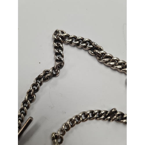 51 - A silver pocketwatch by Aaron Lufkin Dennison, on a silver chain. With two miniature silver Swiss po... 