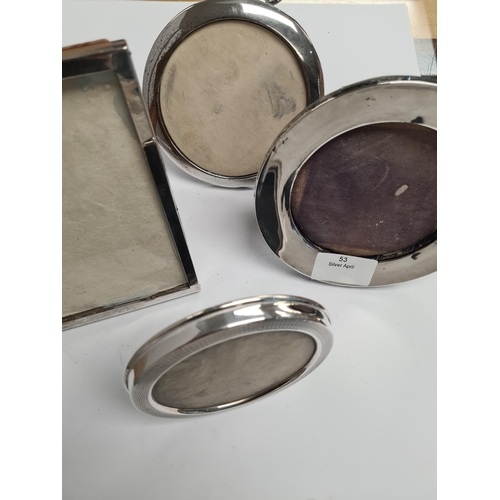 53 - Various silver photo frames of different styles. One by Charles S Green and Co Ltd., one Mappin and ... 