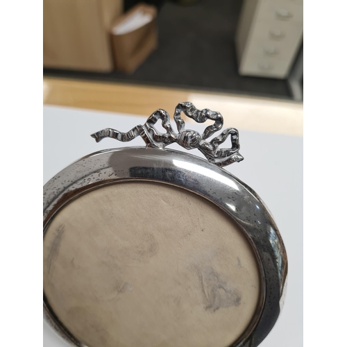 53 - Various silver photo frames of different styles. One by Charles S Green and Co Ltd., one Mappin and ... 