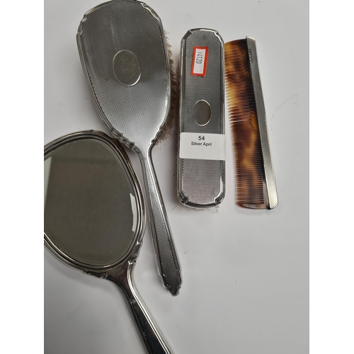 54 - Silver dressing table, items by Deakin and Francis Ltd., Birmingham 1975-1976. Having engine turned ... 