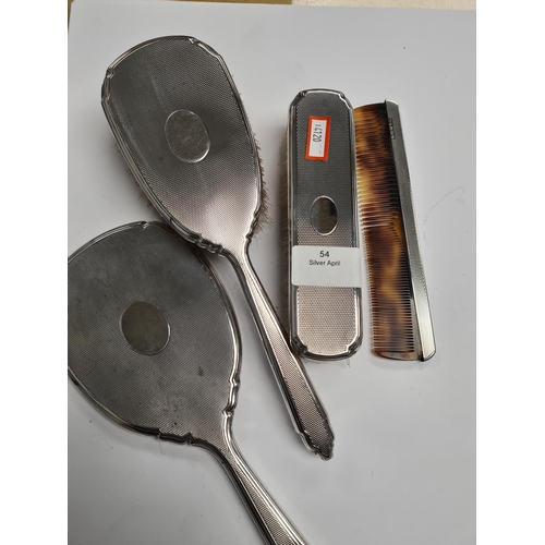 54 - Silver dressing table, items by Deakin and Francis Ltd., Birmingham 1975-1976. Having engine turned ... 