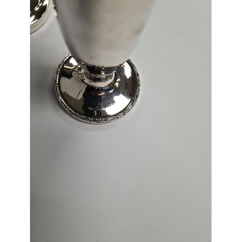 55 - Two silver vases, one by Sanders and Mackenzie, the other possibly S and C however, worn. One tapere... 