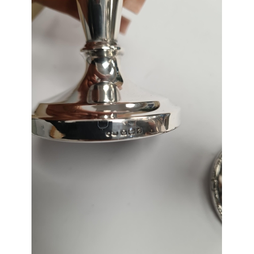 55 - Two silver vases, one by Sanders and Mackenzie, the other possibly S and C however, worn. One tapere... 