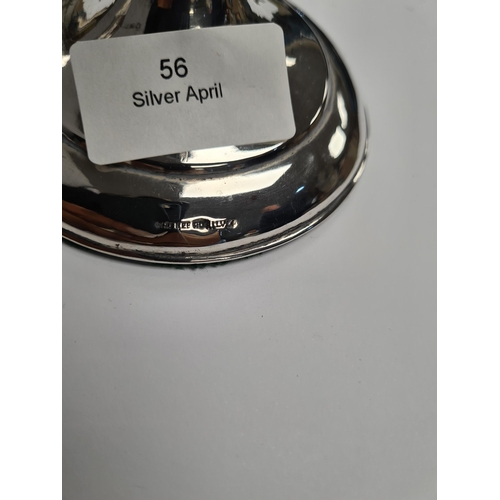 56 - A silver candlestick by Wai Kee, and a miniature candlestick by ESC, 21.5cm approx and 7.5cm approx ... 