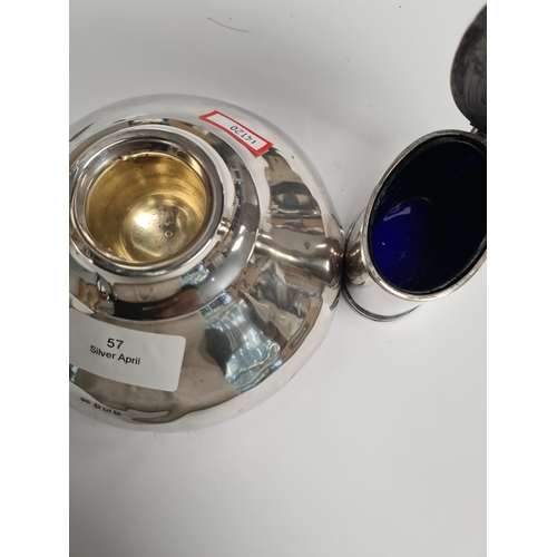 57 - A silver inkwell by Deakin and Francis Ltd., Birmingham 1921. Also with a silver mustard by Goldsmit... 