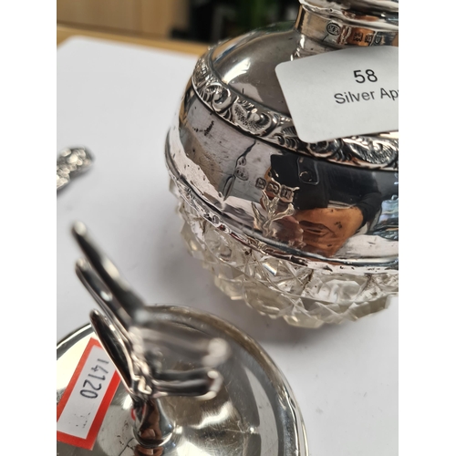 58 - A very decorative silver scent bottle having cut glass bulbous body. Decorative, embossed borders, h... 