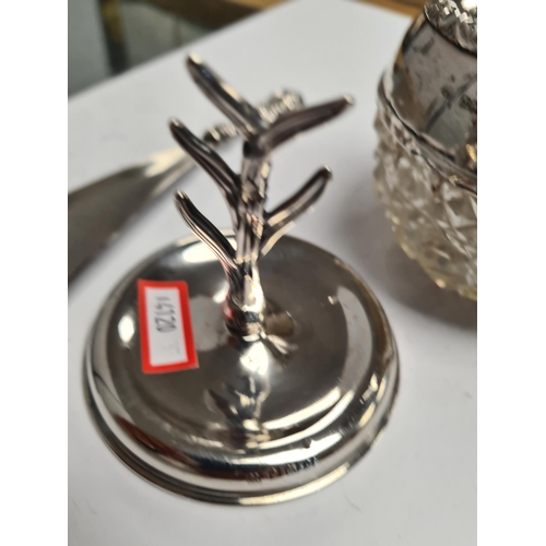 58 - A very decorative silver scent bottle having cut glass bulbous body. Decorative, embossed borders, h... 