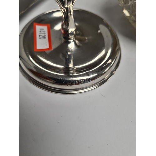 58 - A very decorative silver scent bottle having cut glass bulbous body. Decorative, embossed borders, h... 