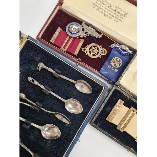59 - A cased set of silver Industria Argentina teaspoons. And a cased medals, some silver, some Masonic r... 