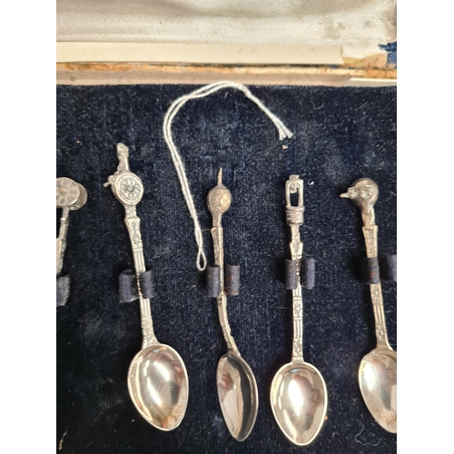 59 - A cased set of silver Industria Argentina teaspoons. And a cased medals, some silver, some Masonic r... 
