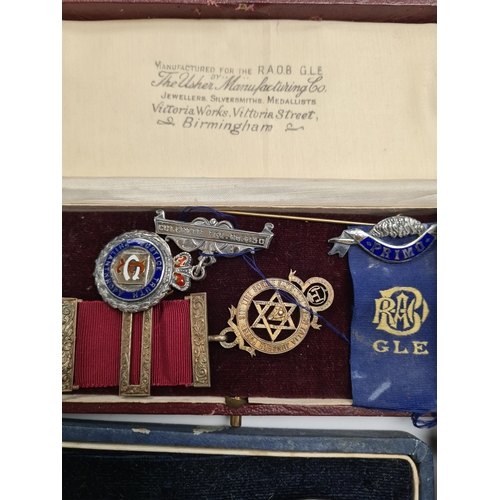 59 - A cased set of silver Industria Argentina teaspoons. And a cased medals, some silver, some Masonic r... 