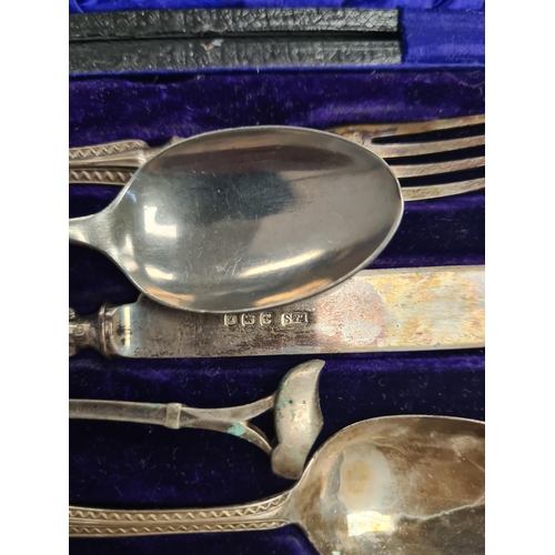 6 - A cased christening set by Levi and Salaman, Birmingham 1908 - 1909. Patterned bordered handle. 1.55... 