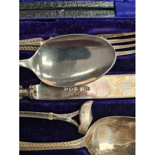 6 - A cased christening set by Levi and Salaman, Birmingham 1908 - 1909. Patterned bordered handle. 1.55... 