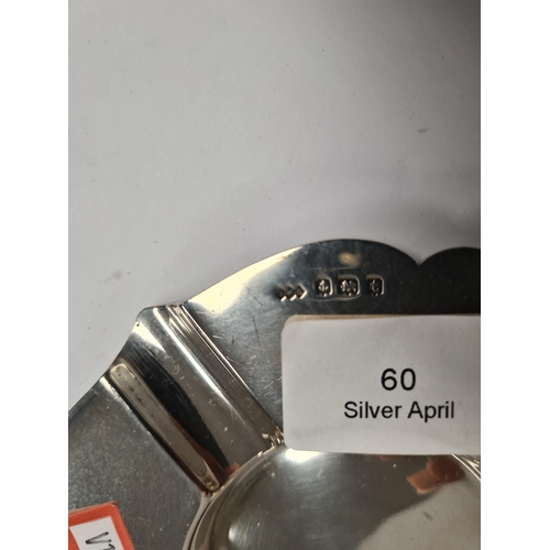 60 - A silver pocketwatch by H Samuel Ltd., a John William Barrett silver ashtray, and a very decorative ... 