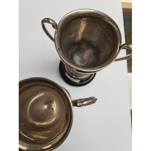 7 - Two silver trophy cups, one by Alexander Clark and Co Ltd., the other Elkington and Co Ltd., 1934 an... 