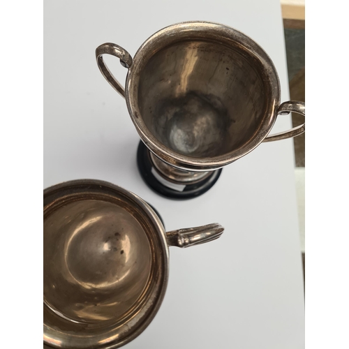 7 - Two silver trophy cups, one by Alexander Clark and Co Ltd., the other Elkington and Co Ltd., 1934 an... 
