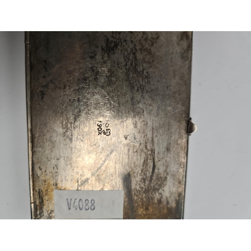 9 - A decorative silver case having central embossed details in relief, with beaded border and engraved ... 