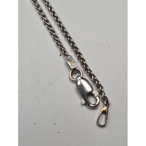 1062 - 9ct white gold herringbone design chain, marked 375, approx 50cm hung with a green hardstone cabouch... 