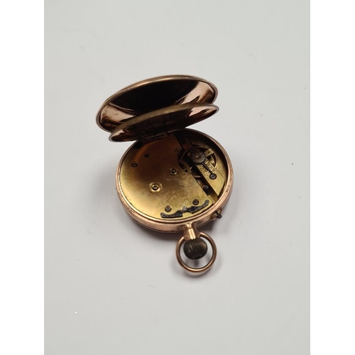 1095 - 9ct gold cased fob watch, with white enamel watch with roman numerals and gilt decoration, with 9ct ... 