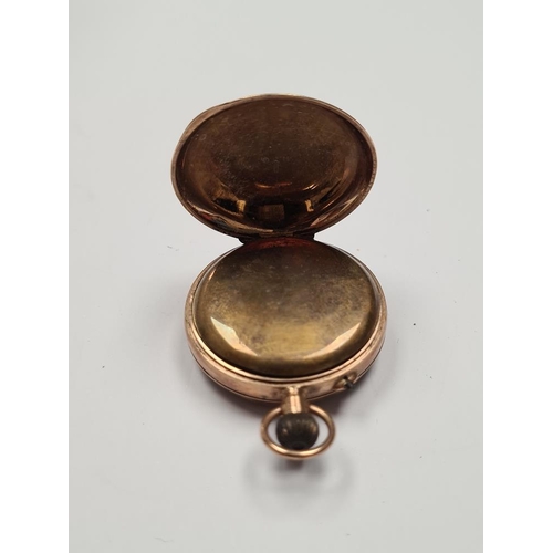 1095 - 9ct gold cased fob watch, with white enamel watch with roman numerals and gilt decoration, with 9ct ... 