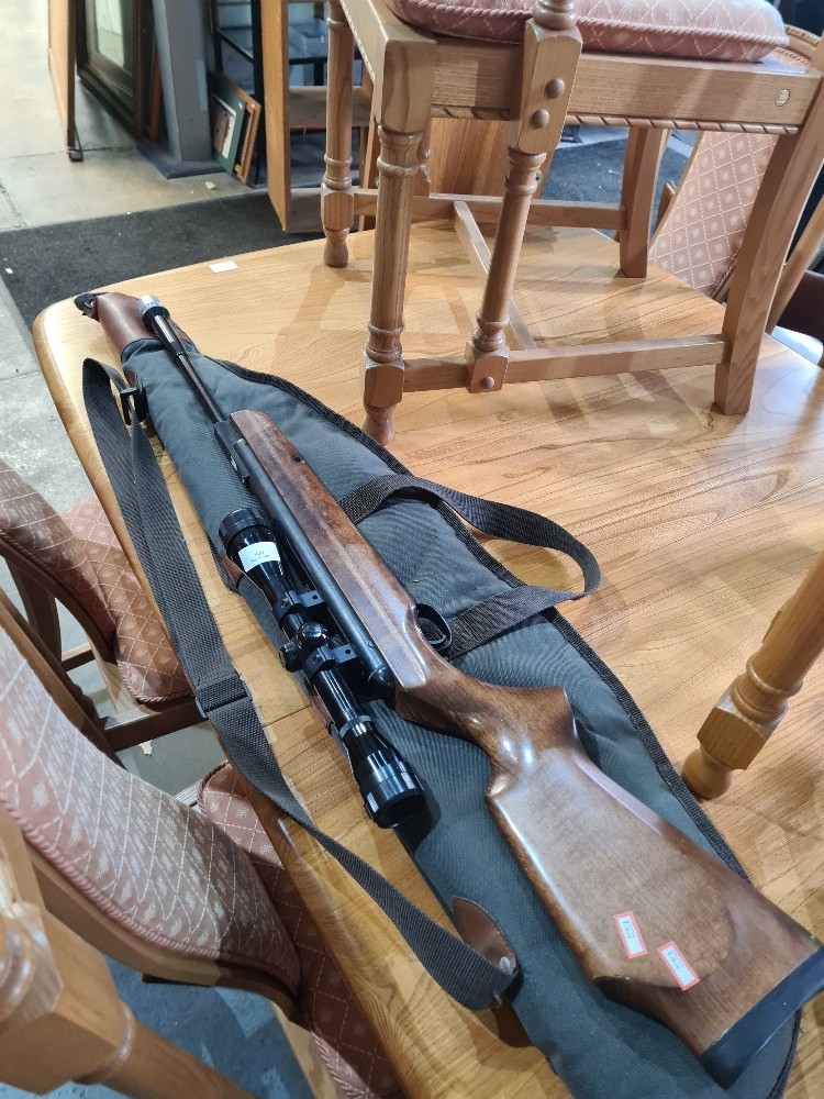 A Webley 'Stingray' air rifle with simmons scope and softcase.