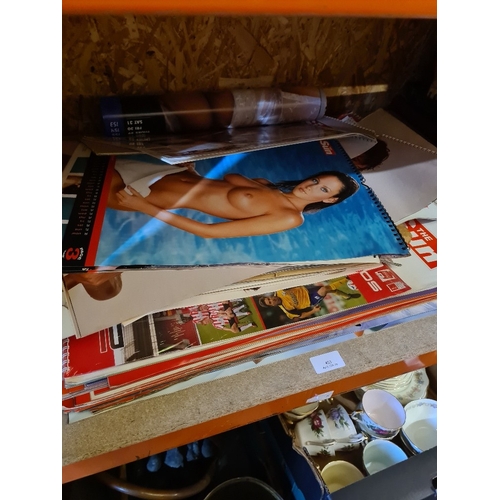 A quantity of 'The Sun' newspaper page 3 calendars, posters and similar. 