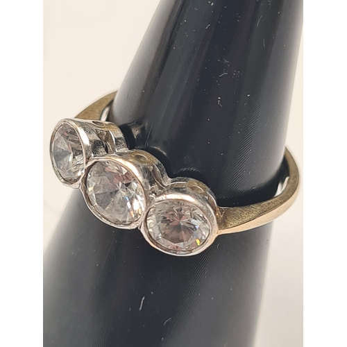 9ct yellow gold dress ring, with 3 ruboer set clear stones, marked 375, size N, 3g