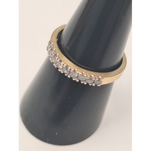 9ct yellow gold band ring inset with cubic zirconia, marked 375, size P, 2.79g