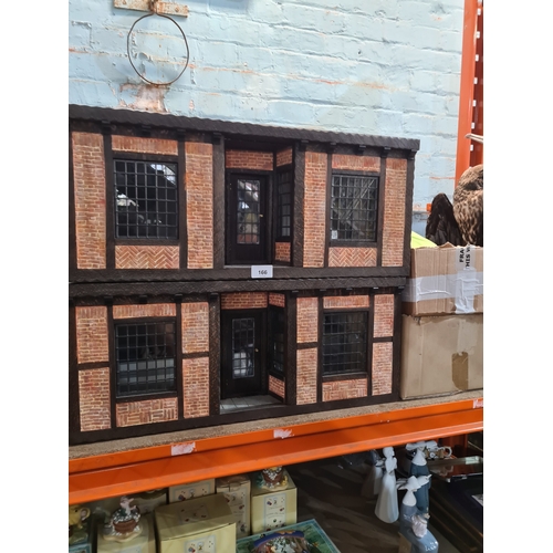 Two model dolls houses in form of shops, one having butchers contents