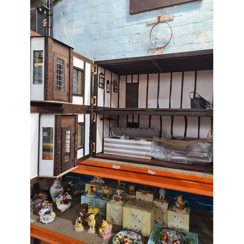 Two model dolls houses in form of shops, one having butchers contents