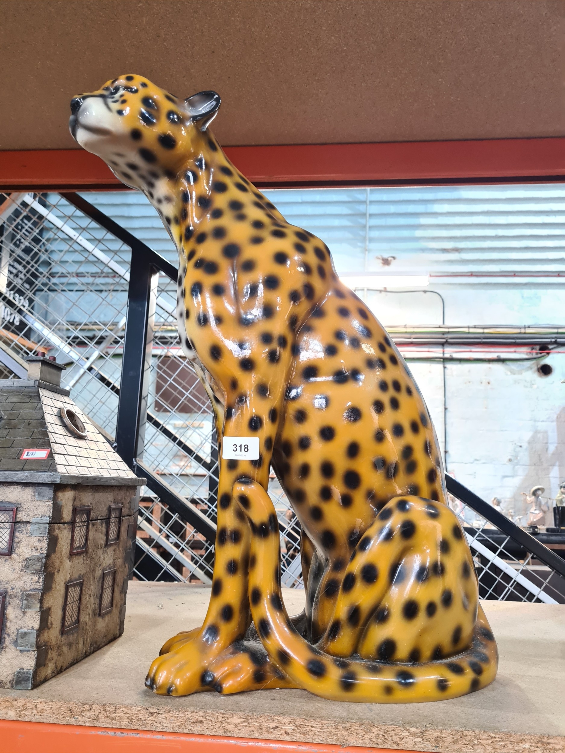 A large resin model of seated Leopard, 60cm.
