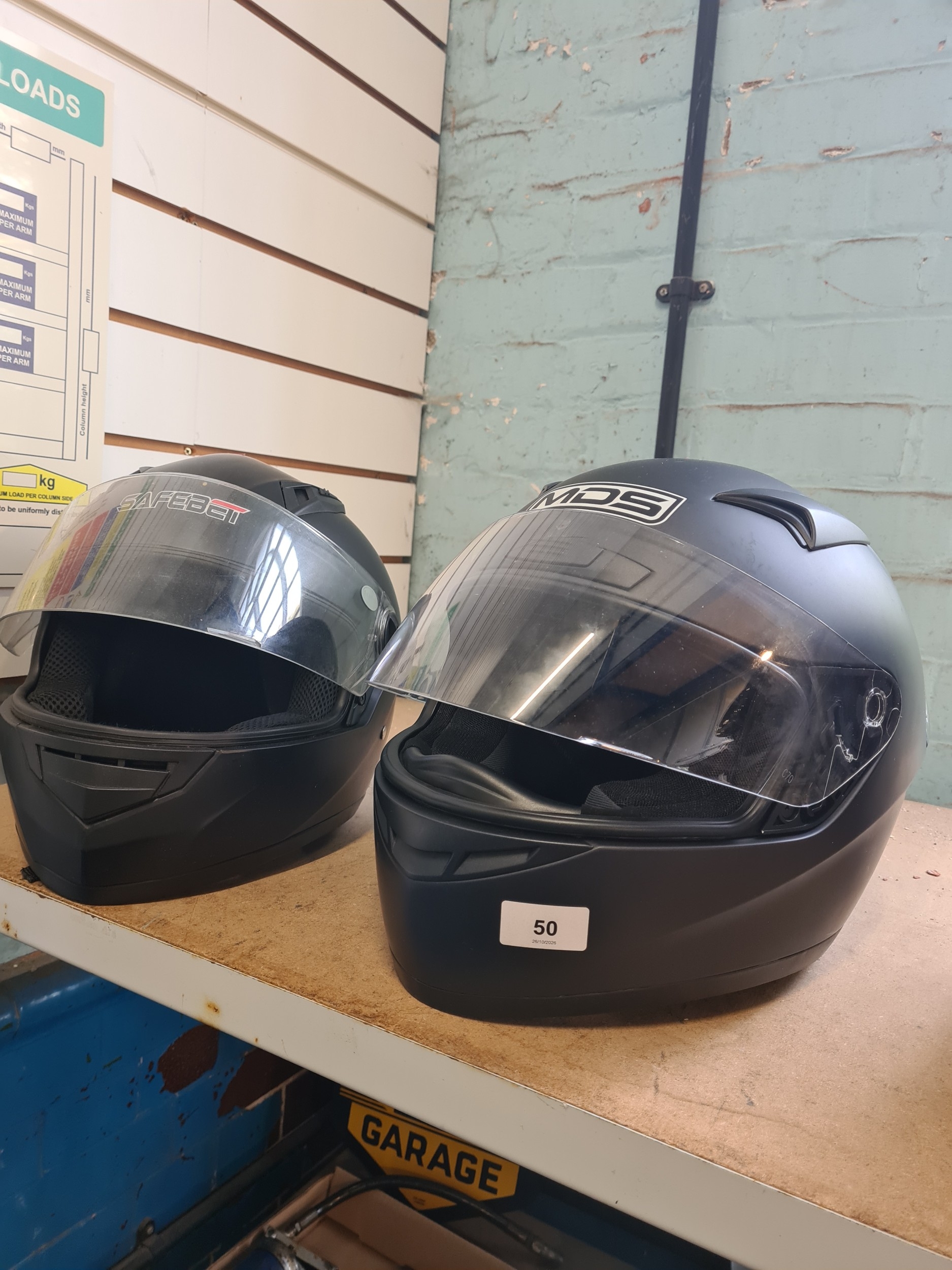 Two full face motorcycle helmets, one size large