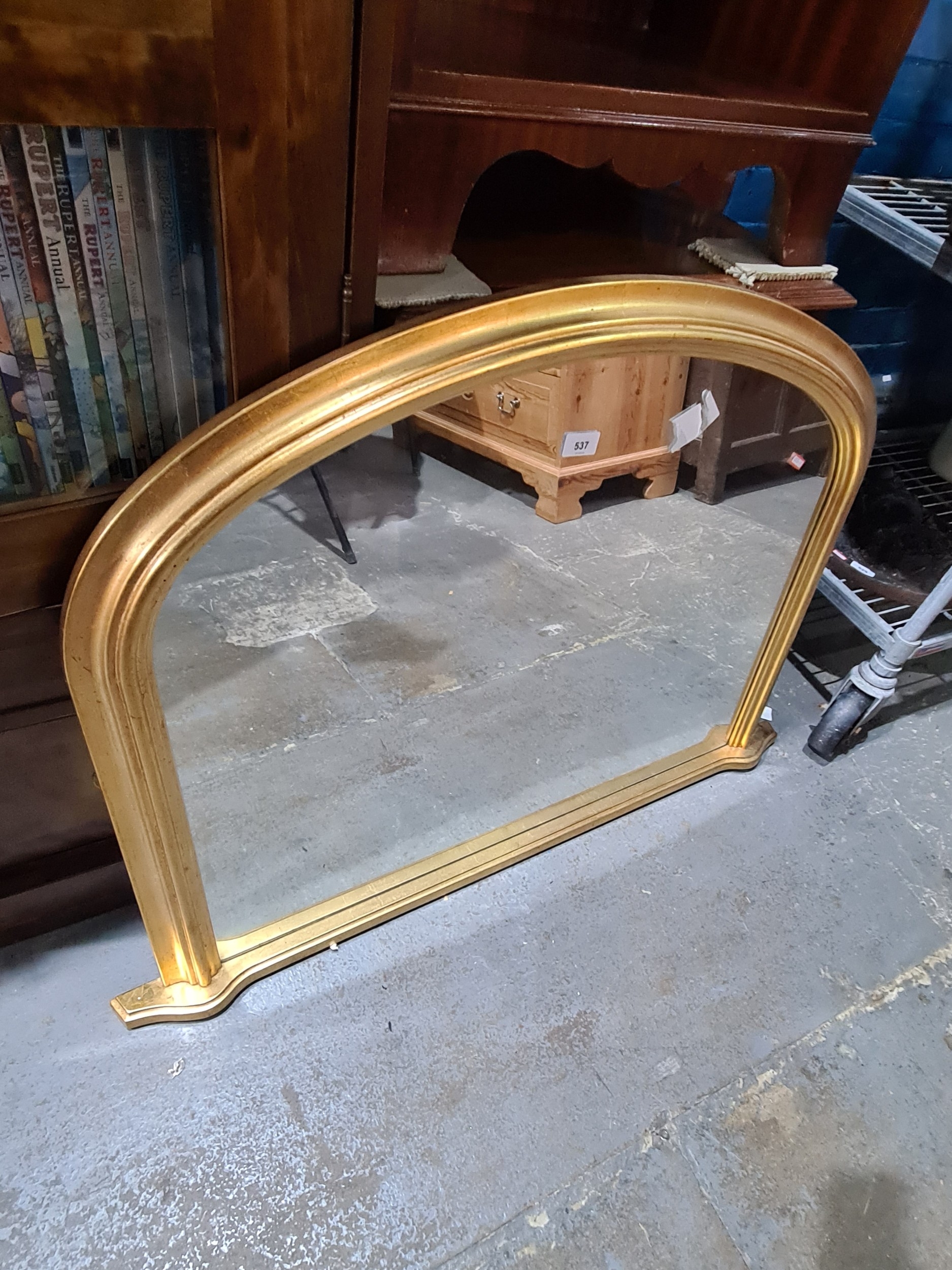 A modern gilt overmantle mirror, of Victorian style.
