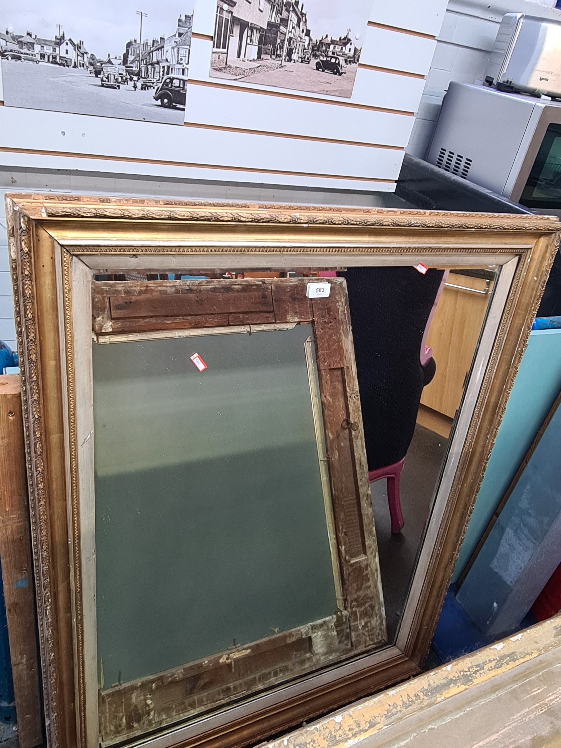 An early 20th century wall mirror having beveled glass, 119cm