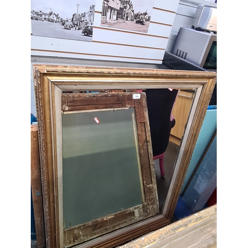 An early 20th century wall mirror having beveled glass, 119cm