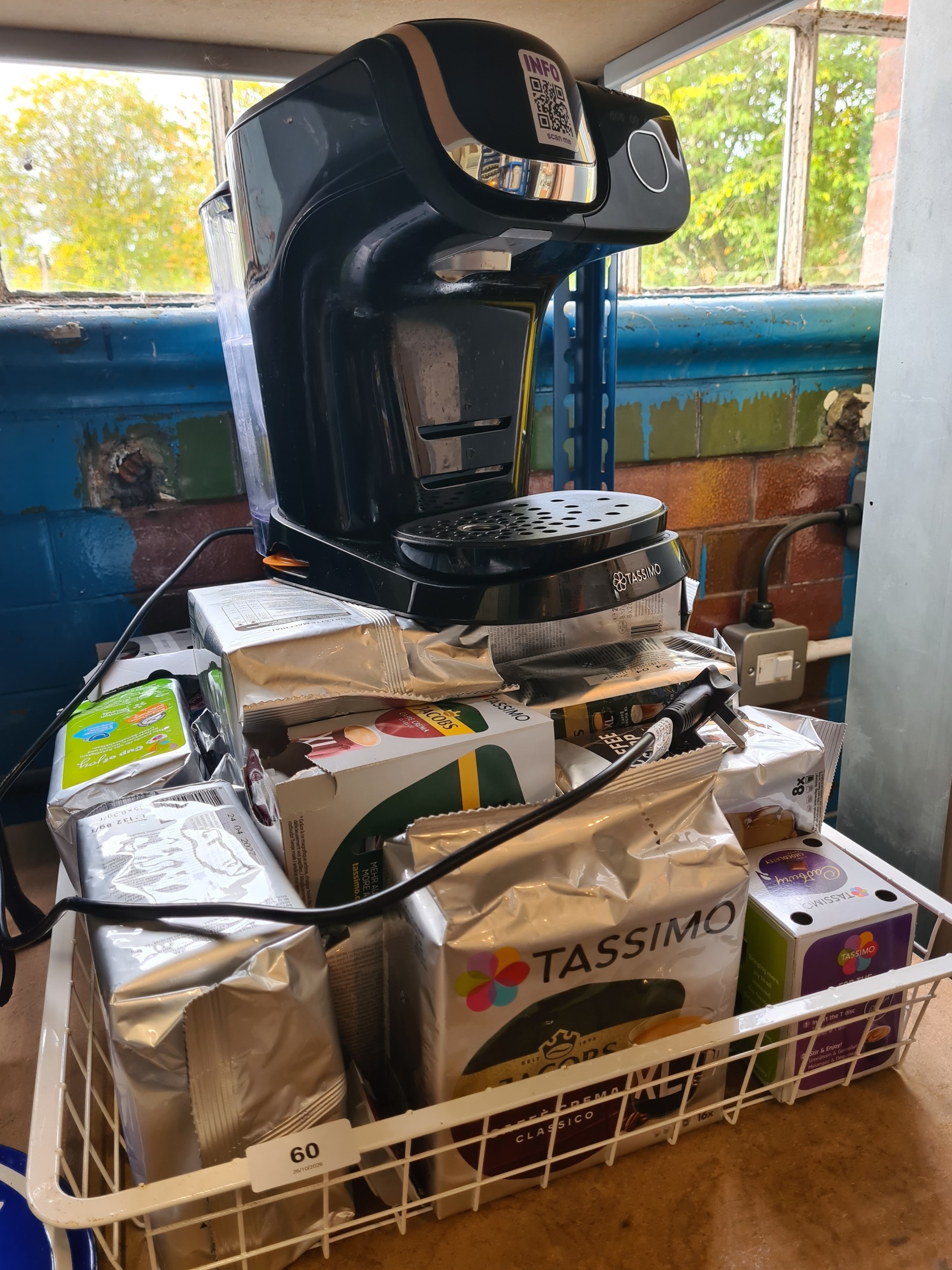 A Bosch Tassimo coffee machine with a large quantity of pods.