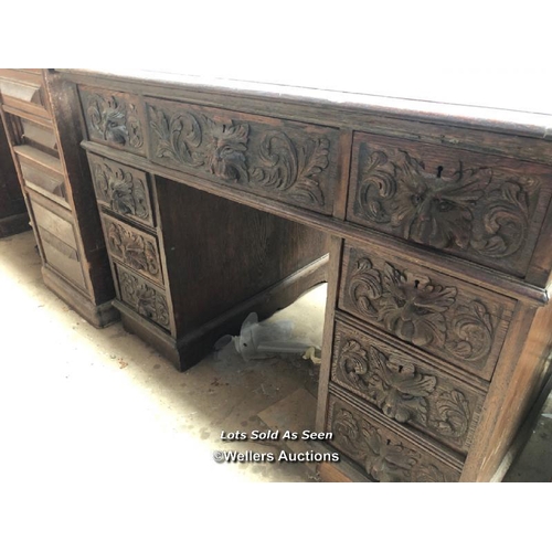 1 - OAK CARVED DESK WITH NINE DRAWERS, 41.5 X 28.5 X 29.5 INCHES / LOCATED AT VICTORIA ANTIQUES, WADEBRI... 