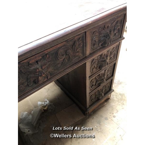 1 - OAK CARVED DESK WITH NINE DRAWERS, 41.5 X 28.5 X 29.5 INCHES / LOCATED AT VICTORIA ANTIQUES, WADEBRI... 