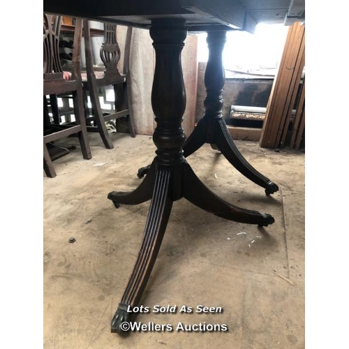 35 - OAK OVAL EXTENDING DINING TABLE ON TWO TRIPOD BASES WITH CLAW FEET, 59.5 X 38.5 X 29.5 INCHES / LOCA... 